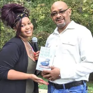 Juan Lee sharing Love Made Simple with a community reader
